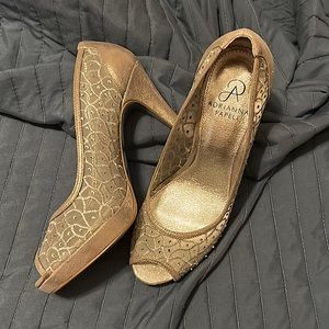 Metallic silver. 4 inch heels. Worn once.